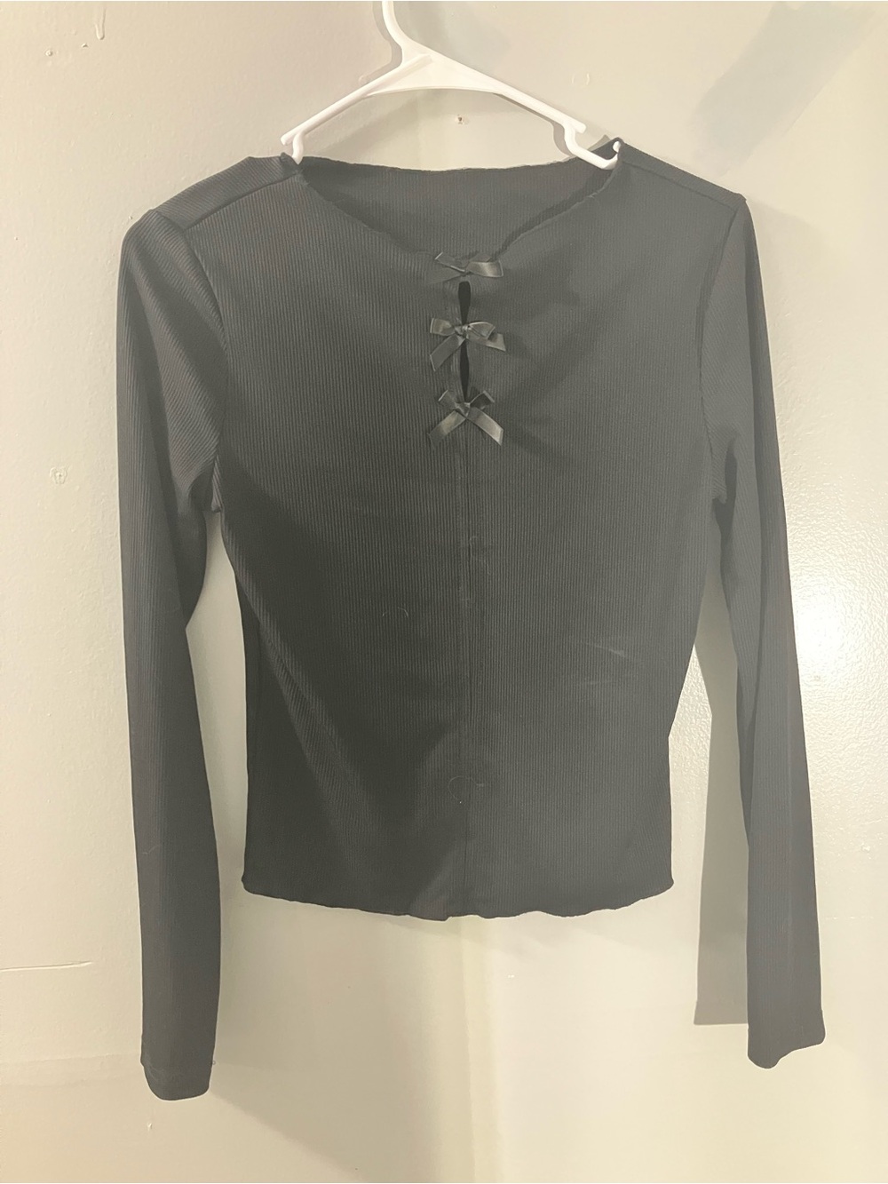 Slim Ribbed Black Long-Sleeve Top with Front Bow Details